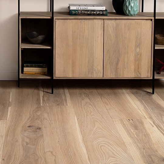 Live Sawn Engineered Wide Plank Ash Flooring installed under a wood bookcase in a residential living space