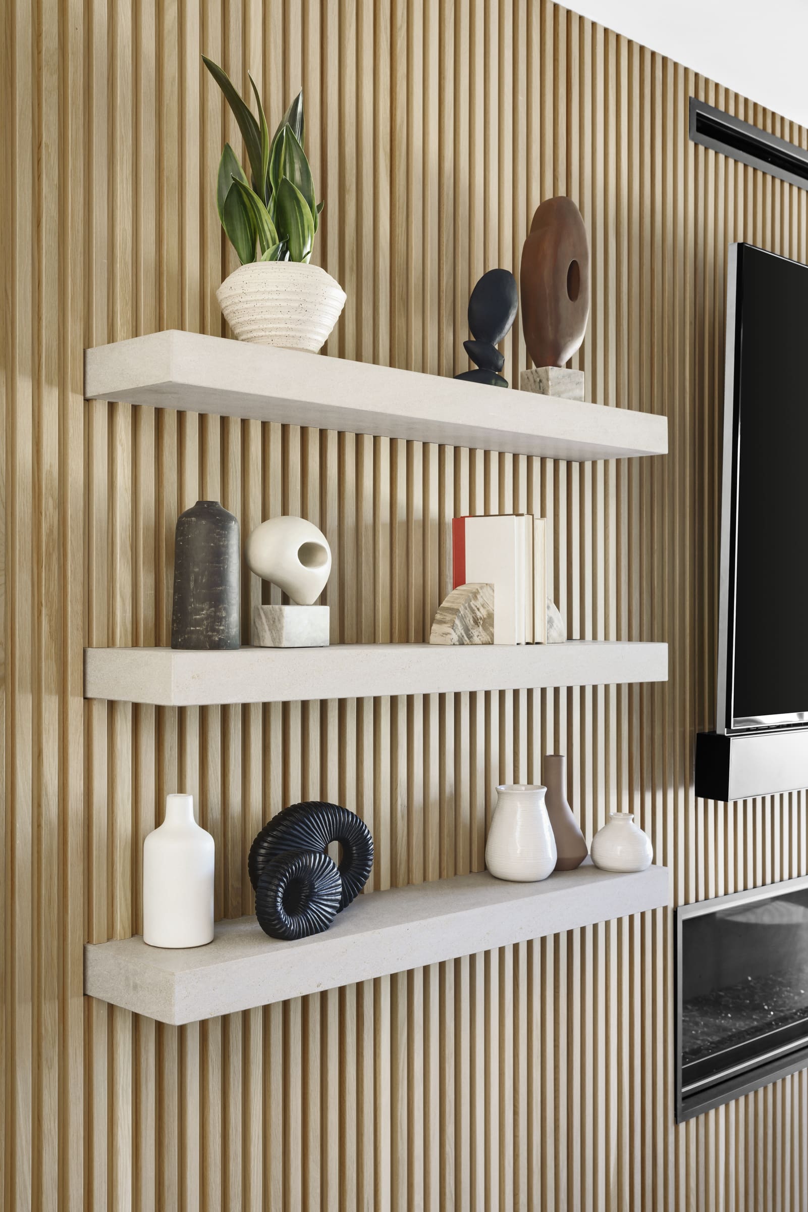 Classic Slat Wood Wall Paneling with decorative shelves
