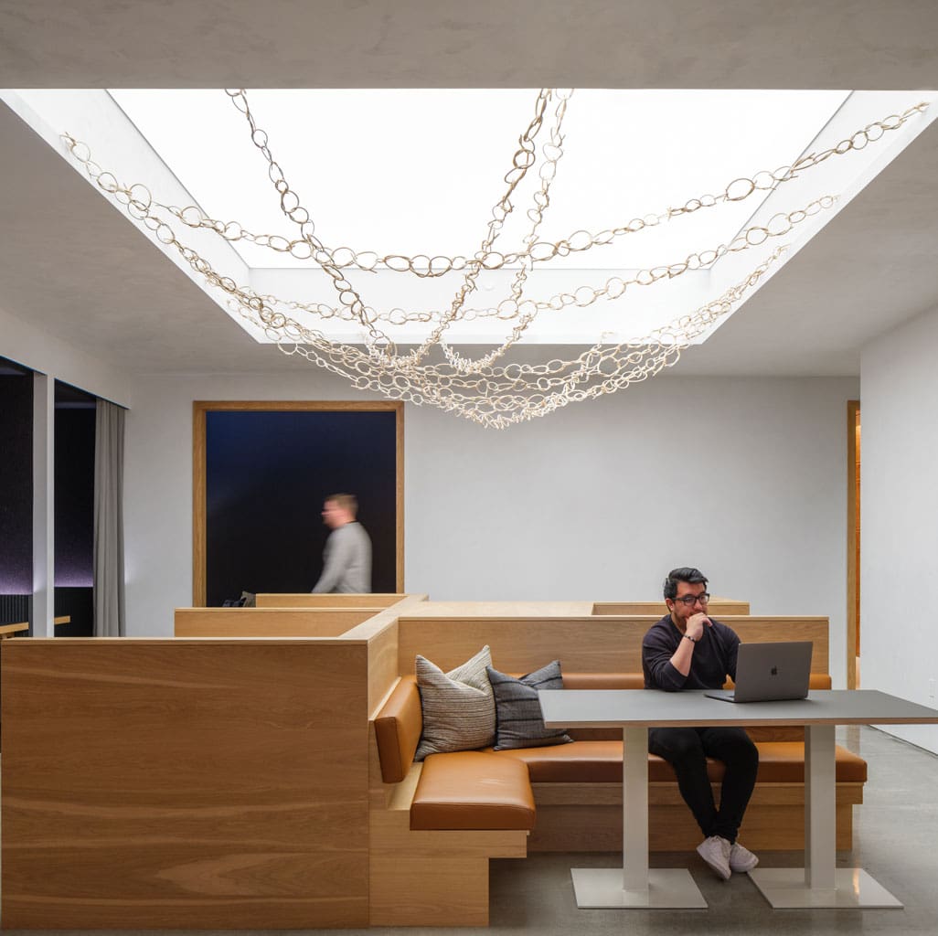 Live Sawn White Oak Veneer Paneling installed as casework and banquettes in a modern office cafeteria