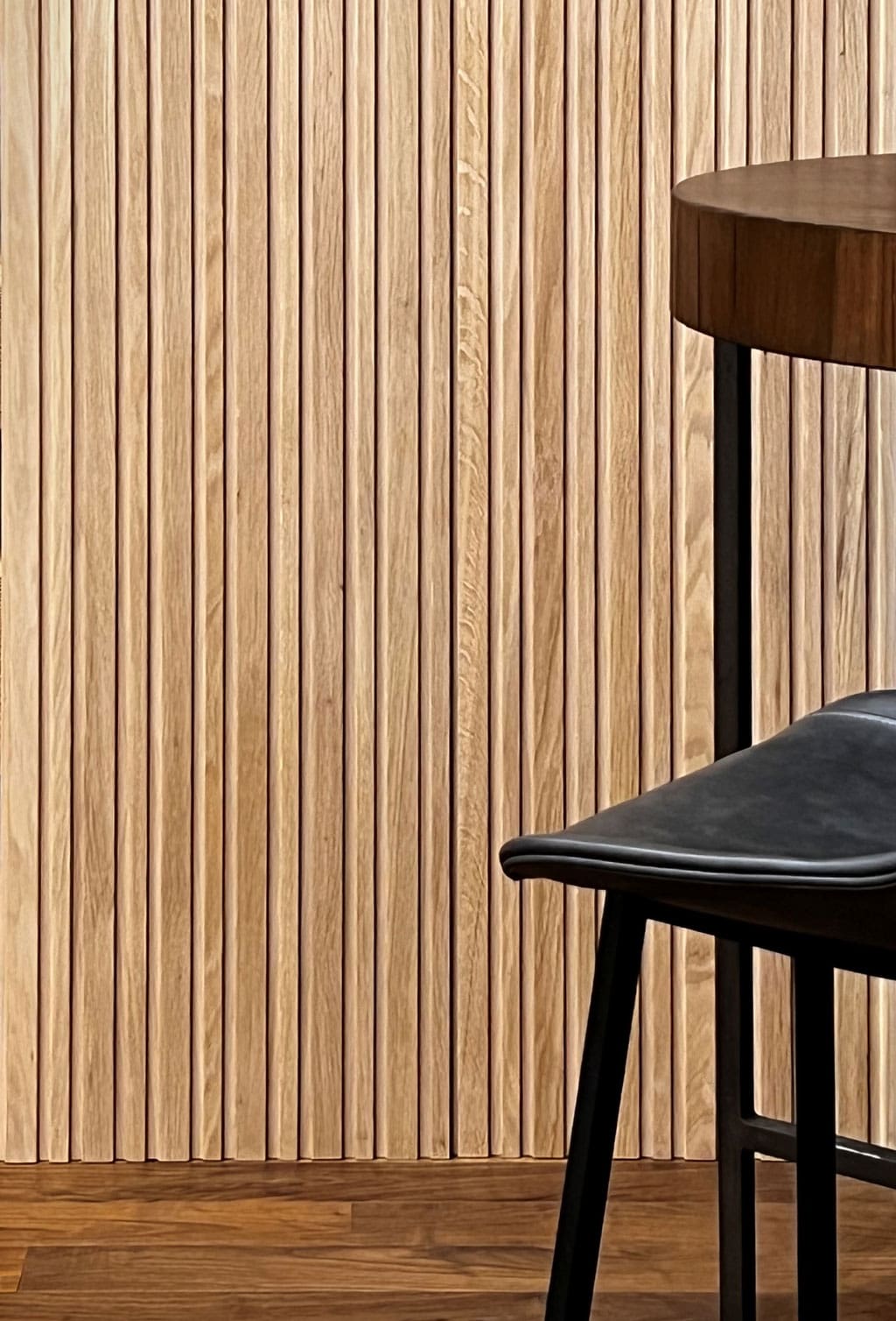 Low Profile Mixed Slat Panels in white oak in feature wall installation