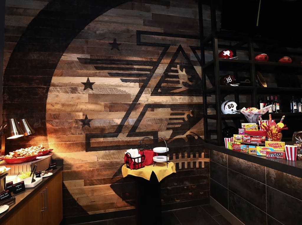 Reclaimed Mixed Hardwood Cladding installed in an NFL stadium lounge