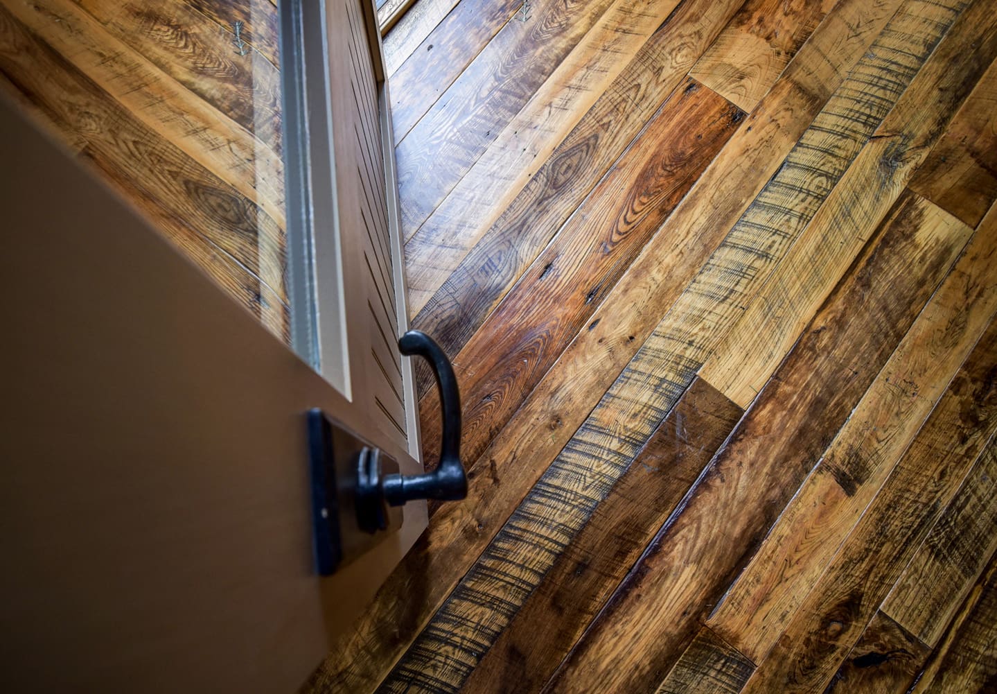 Reclaimed Mixed Hardwood Flooring under an open door