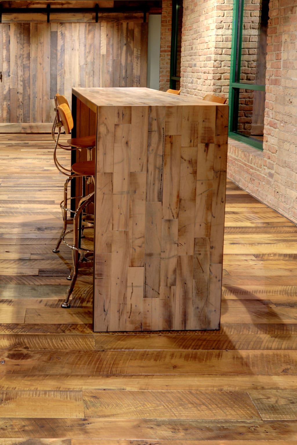Reclaimed Mixed Hardwoods Flooring installed in a rustic office space