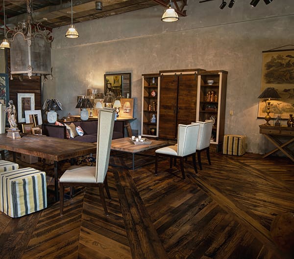 Reclaimed Skip-Planed Oak Flooring with herringbone pattern in a furniture showroom
