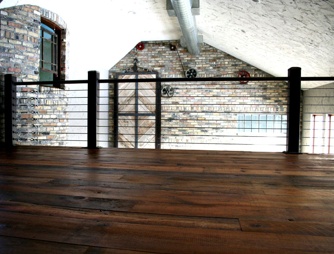 Reclaimed Skip-Planed Patina Pine Flooring installed in a residential loft