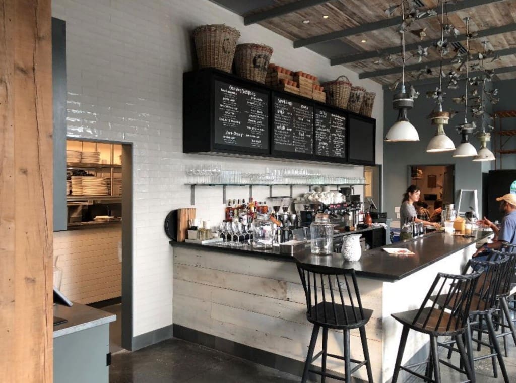 Reclaimed White Wash Oak Cladding installed on a cafe bar front