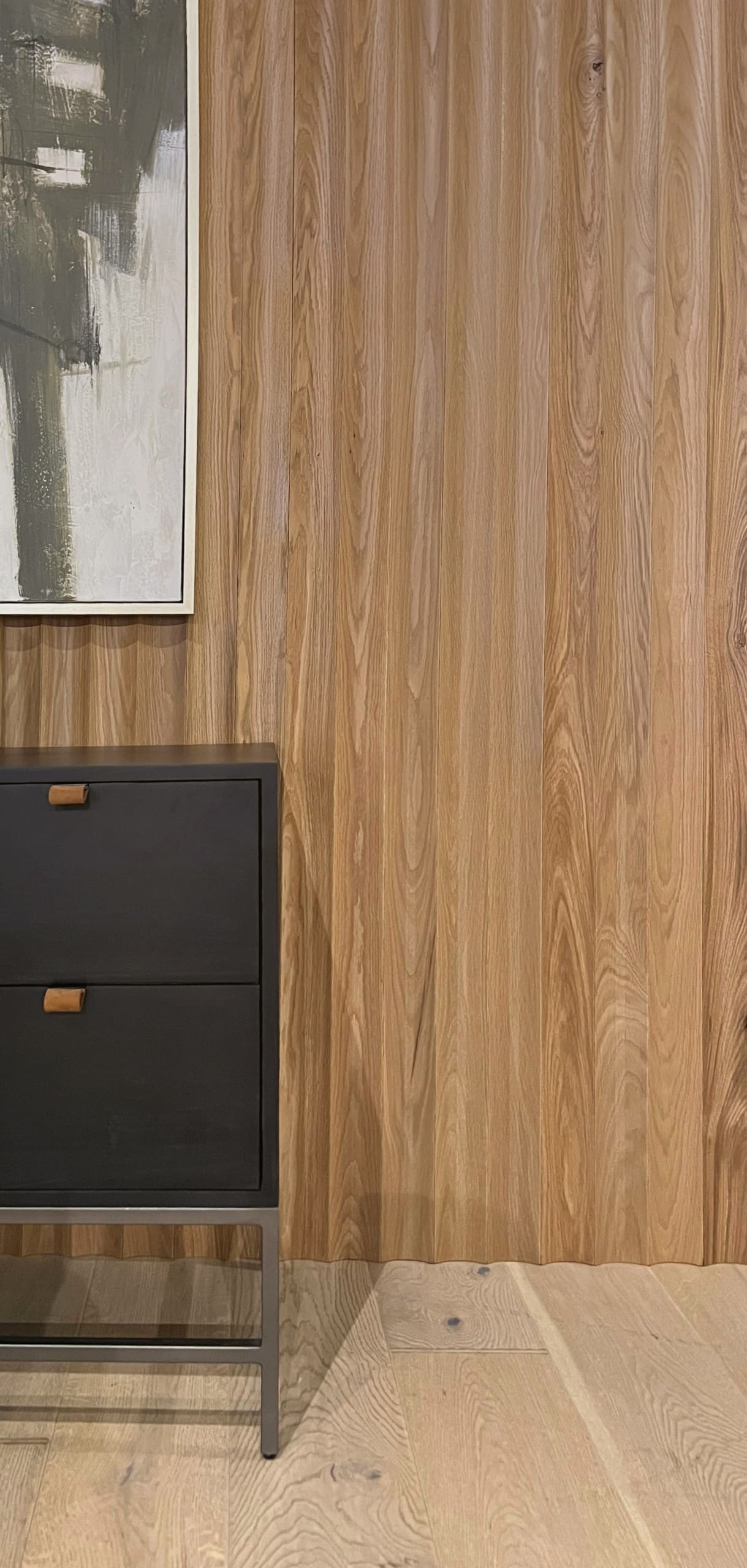 White Oak Solid Wide Fluted Slat Wood Wall Planks installed behind a console and artwork