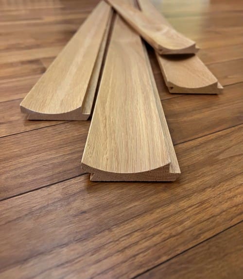 Solid Wide Fluted Slat Wall Planks on floor prior to installation