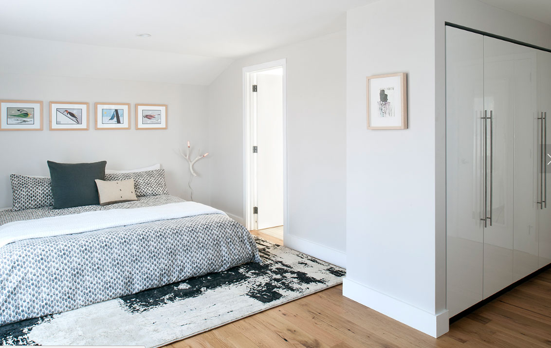 Reclaimed white oak flooring installed in bedroom