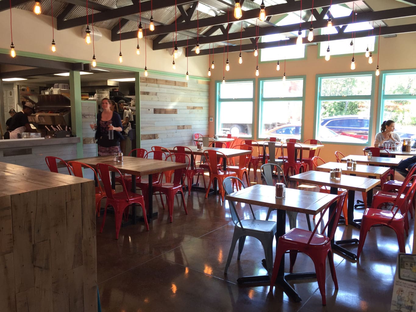 Sky Blue Washed Cladding and Tables Inside Wild Tomato