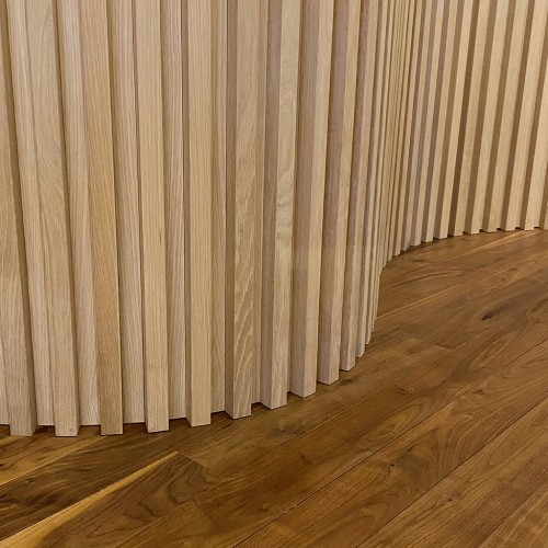 Curved Slat Wood Wall Paneling in White Oak with Clear Matte Finish